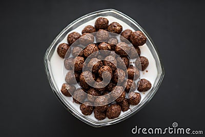 Chocolate cereal balls with milk for breakfast Stock Photo