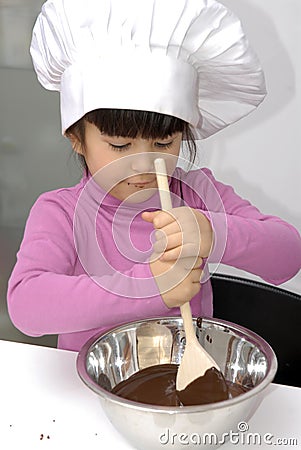 Chocolate Chef kid. Stock Photo