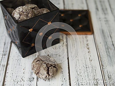 Chocolate chip cookies with cracks, Black metal vintage box with cookies on a white wooden background. Christmas or Stock Photo