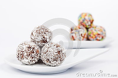 Chocolate and coconut balls on a white plate Stock Photo