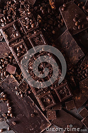 Chocolate, coffee beans. and cocoa powder. Chocolate bar pieces. dark chocolate background. A large bar of chocolate Stock Photo