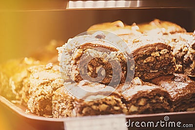 chocolate cookies. assortment baked pastry in bakery. Various Different Types Of Sweet Cakes In Pastry Shop Glass Stock Photo