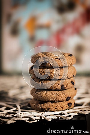 Chocolate cookies on centerpieces, colored background and bokeh Stock Photo