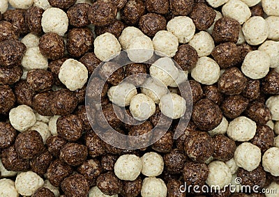 Chocolate corn flakes teture background. Chocolate puff cereal background. Macro shot Stock Photo