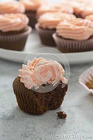 Chocolate cupcakes with strawberry buttercream, selective focus Stock Photo