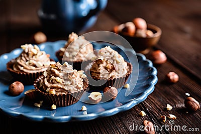 Chocolate cups with hazelnut cream Stock Photo