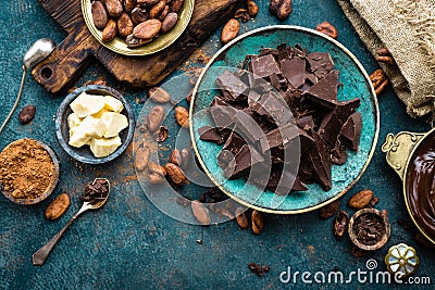 Chocolate. Dark bitter chocolate chunks, cacao butter, cocoa powder and cocoa beans. Chocolate background Stock Photo