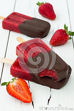 Chocolate dipped strawberry red wine popsicles. Stock Photo