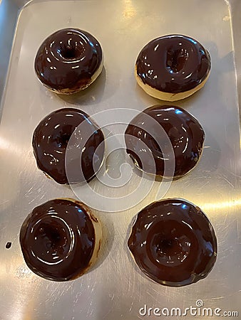 a chocolate donut fresh from oven Stock Photo