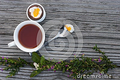 Chocolate Easter egg and cup of tea Stock Photo