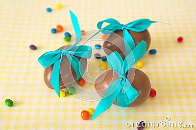 Chocolate Easter eggs over yellow tablecloth Stock Photo