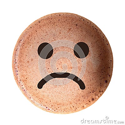 Chocolate foam with sad face isolated on white background. Stock Photo