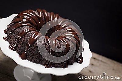 Chocolate Ganache Bundt Cake on Cake Stand Stock Photo