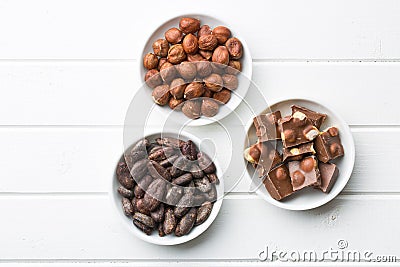 Chocolate, hazelnuts and cocoa beans Stock Photo