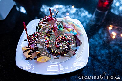 Chocolate ice cream on a black stone. Stock Photo