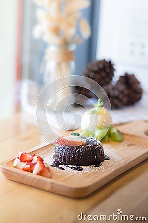 Chocolate lava cake with vanilla ice cream and strawberry Stock Photo