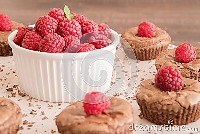 Chocolate lava cakes with fresh raspberries, mint and chocolate pieces Stock Photo