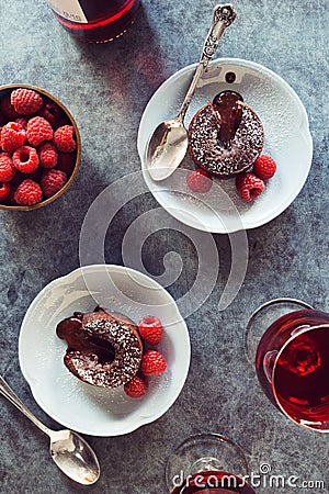 Chocolate Lava Cakes with Raspberries and Wine Stock Photo