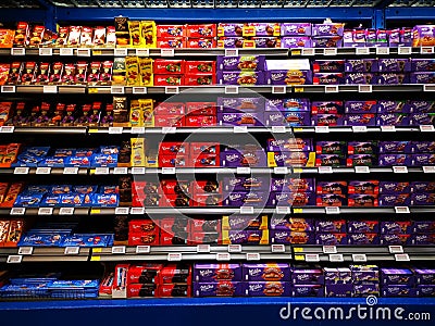 Chocolate of many kinds on shelves at Selgros Editorial Stock Photo