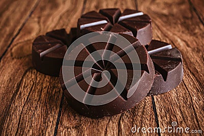 Chocolate mexicano, cinnamon sticks and mexican chocolate from oaxaca mexico on wooden in rustic style Stock Photo