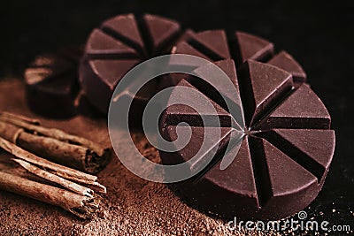 Chocolate mexicano, cinnamon sticks and mexican chocolate from oaxaca mexico on wooden in rustic style Stock Photo