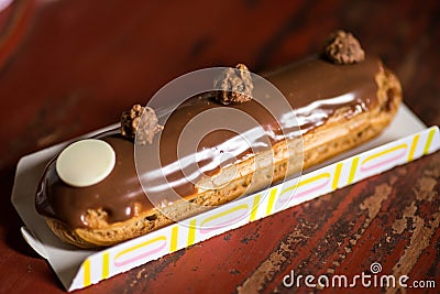 Chocolate and milk eclair Stock Photo