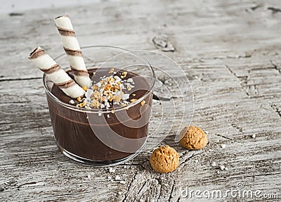 Chocolate mousse with biscuits in glass beakers Stock Photo