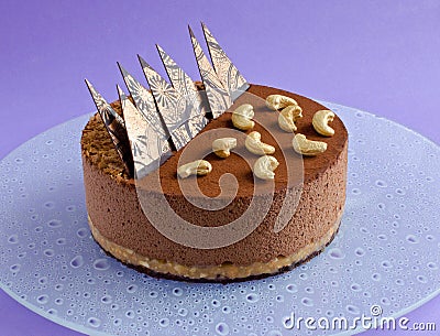 Chocolate mousse cake on purple background Stock Photo