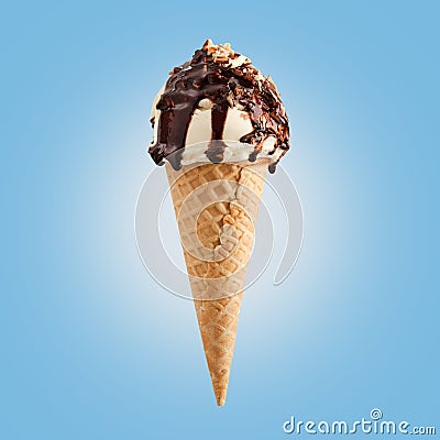 Chocolate nuts ice cream cone on blue background Stock Photo