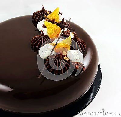 Chocolate and orange cake with mirror glaze and whipped cream Stock Photo