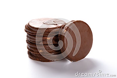 Chocolate outer biscuits stacked up on white Stock Photo