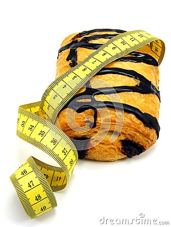 Chocolate pastry cake & measuring tape Stock Photo