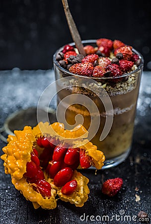 Chocolate pudding with strawberries and a clear glass Stock Photo