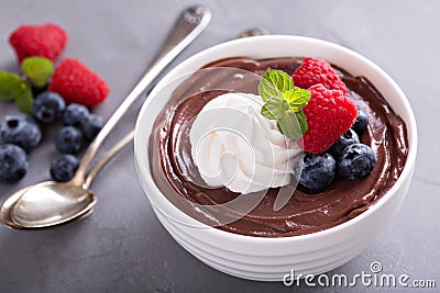 Chocolate pudding with whipped cream and berries Stock Photo