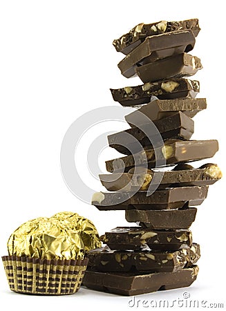 Chocolate pyramid and two gold balls Stock Photo