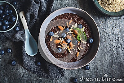 Chocolate Quinoa porridge with almonds and blueberry Stock Photo