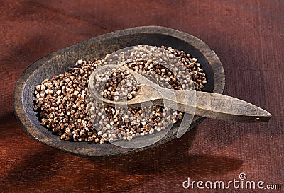 Chocolate quinoa seeds in the wooden bowl Stock Photo