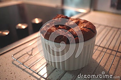 A Chocolate Souffle in a White Ramekin Stock Photo