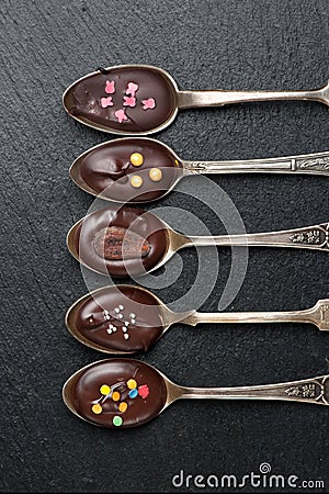 Chocolate spoons and chalk board Stock Photo