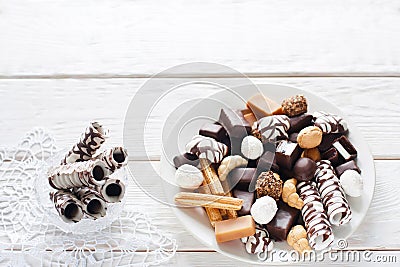 Chocolate sweets on white background flat lay Stock Photo