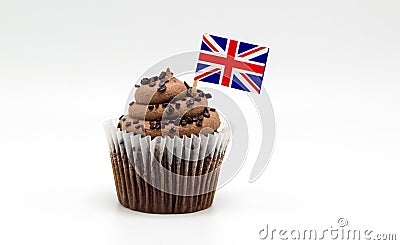 Chocolate swirl cupcake with a British Union Jack flag toothpick in it isolated on white Stock Photo