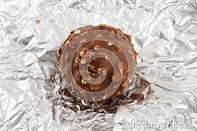 Chocolate truffle on silver wrapper Stock Photo