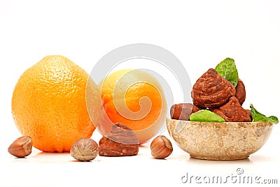 Chocolate truffles, hazelnuts and oranges Stock Photo