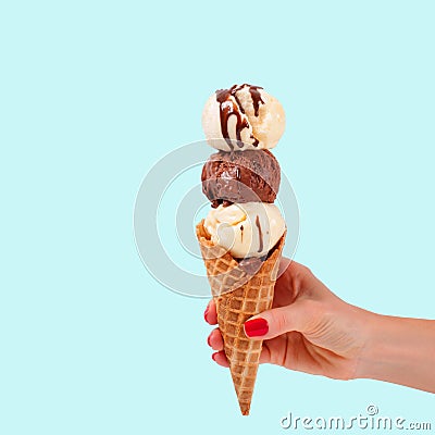 Chocolate and vanilla ice cream cone on faded pastel color background Stock Photo