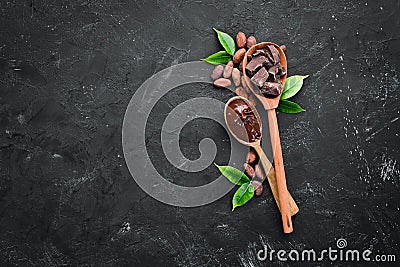 Chocolate in a wooden spoon. cocoa. Stock Photo