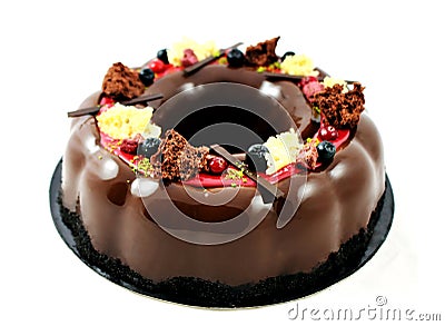 Chocolate wreath cake with berries and mirror glaze Stock Photo