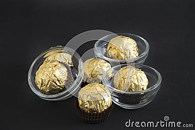 Golden chocolates Stock Photo