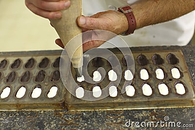 Chocolatier making praline Stock Photo