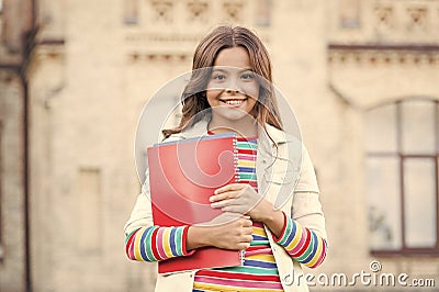 Choice course. Modern education. Kid smiling girl school student hold workbooks textbooks for studying. Education for Stock Photo