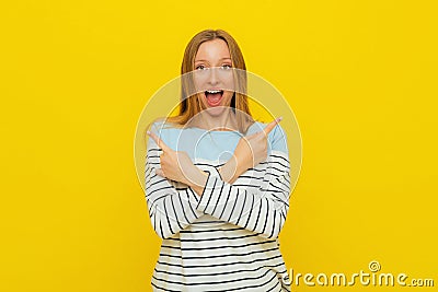 Choice, decision. Upbeat excited girl with fair-haired, smiling broadly, pointing sideways, showing left and right, two ways, Stock Photo